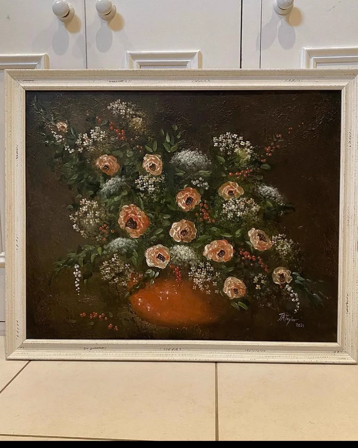 A framed floral painting by Julia ready for the Affordable Art Fair